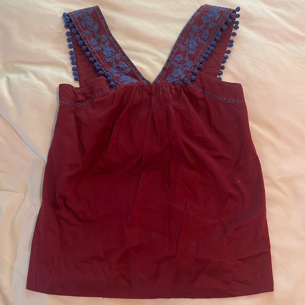 Red J. Crew gently worn blouse with blue embroidery on the straps. Size 4